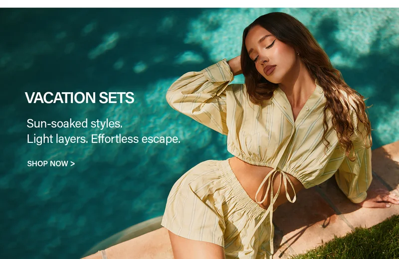 Relaxed woman in a pale yellow striped crop top and shorts vacation set, basking by a teal pool. Discover sun-soaked summer styles.