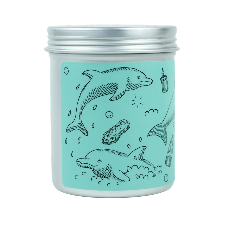 A metal jar with a blue label- a candle inside