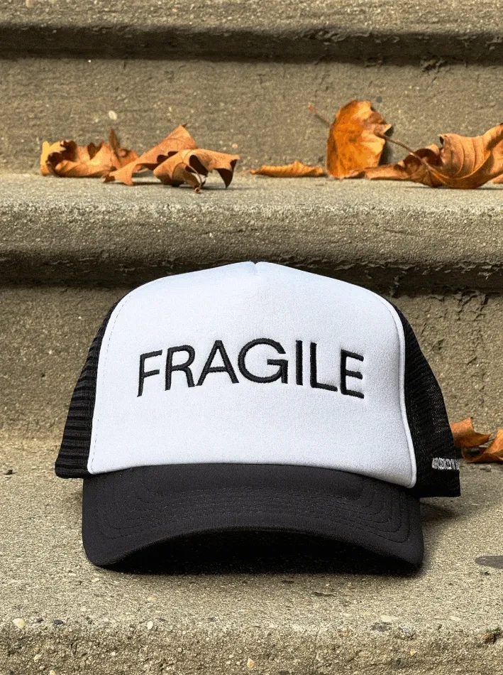 A GIF of trucker hats that read “Fragile,” “Beaux Arts,” and “Art Baby”