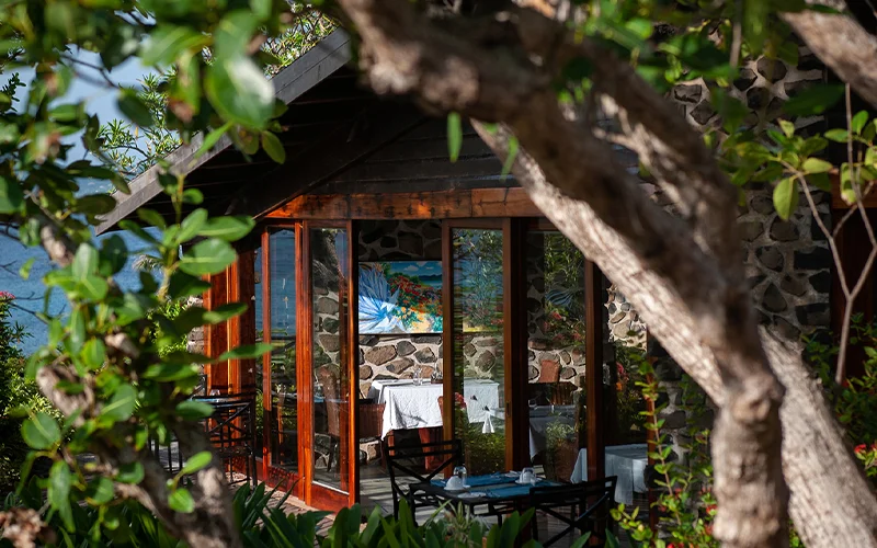The Petit St. Vincent Resort’s main dining room sits atop a tiny hill overlooking the water.