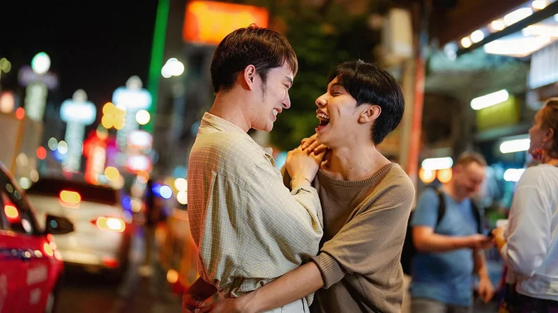 Image description: Couple exploring Bangkok nightlife.