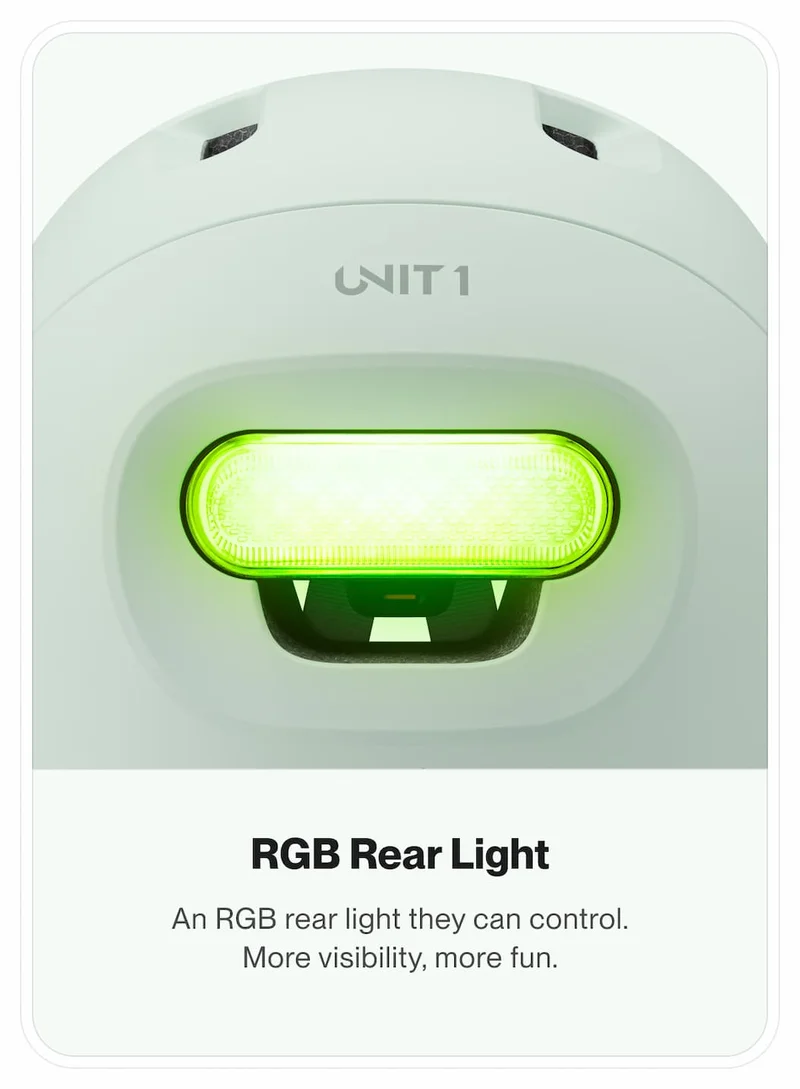 Close-up of the SPARKY helmet showing the green RGB rear light illuminated.