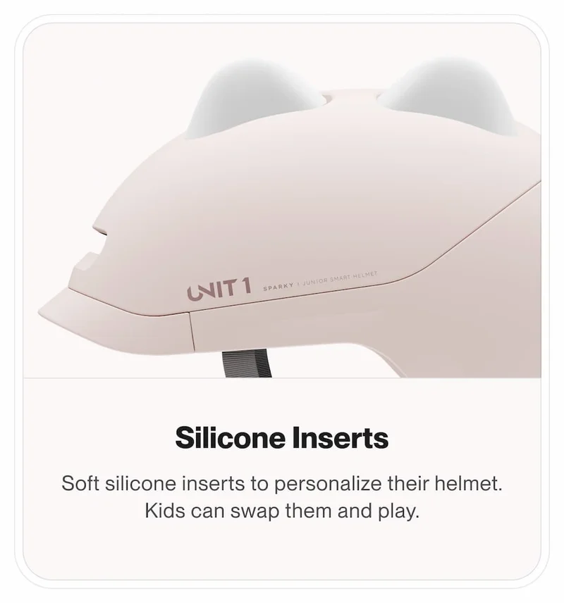 Side view of the pink SPARKY helmet featuring interchangeable silicone inserts.