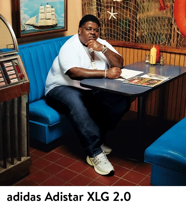 A man wearing adidas Adistar XLG 2.0 sneakers.