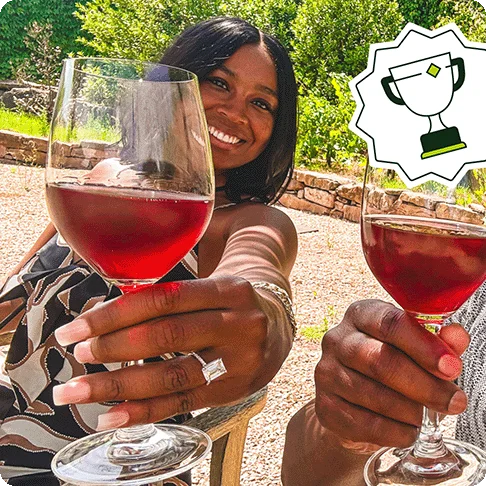 Image Description: Two people holding wine glasses. A trophy icon is on the top right of the image.