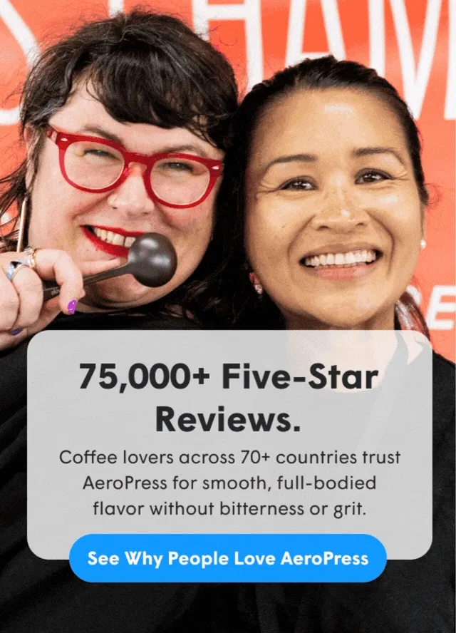Smiling people with AeroPress coffee makers