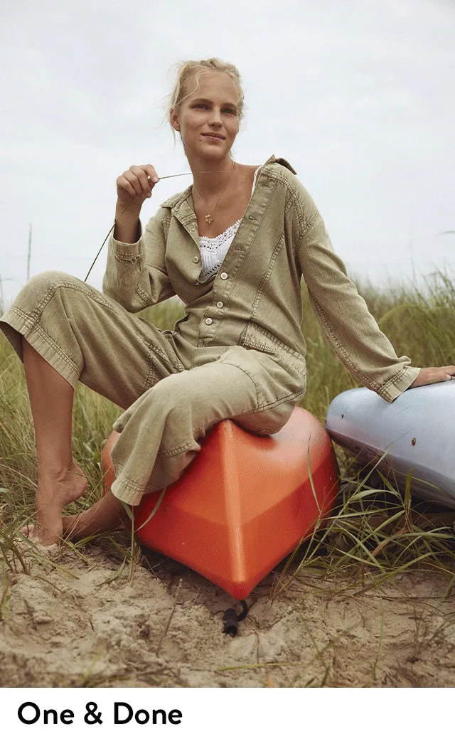 A woman wearing a tan jumpsuit. A woman wearing denim overalls.