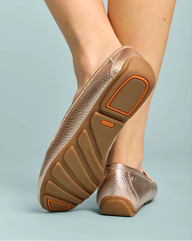 Driver sole of women’s Ozzie loafer in Soft Rose Gold pebbled leather. Shop Now.