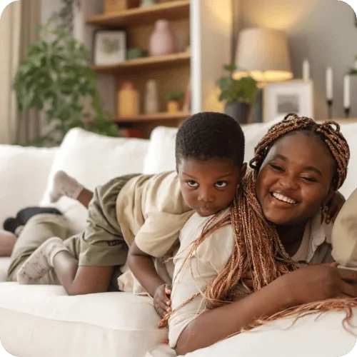 a mom playing a game with her kid while lying down a mom playing a game with her kid while lying down