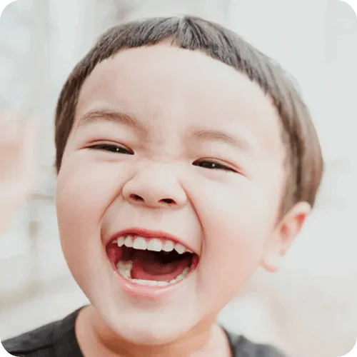 a toddler laughing at giggle-inducing jokes for toddlers a toddler laughing at giggle-inducing jokes for toddlers