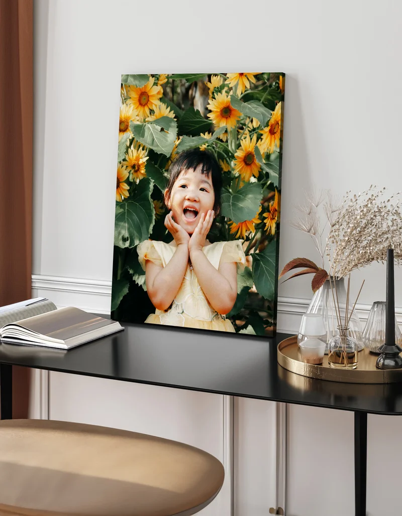 Canvas print of little girl in sunflower field.