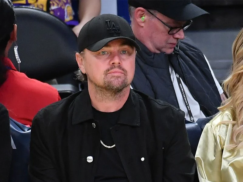 Image may contain: Leonardo DiCaprio, Mitch Ryder, Wristwatch, Arm, Body Part, Person, Clothing, Hat, Baseball Cap, and Cap