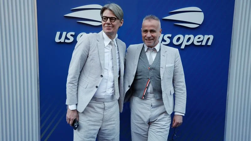 NEW YORK, NEW YORK - AUGUST 28: Thom Browne and Andrew Bolton attend day five of the 2025 US Open Tennis Championships at USTA Billie Jean King National Tennis Center on August 28, 2025 in Flushing Meadows, Queens, New York City. (Photo by Jean Catuffe/GC Images)