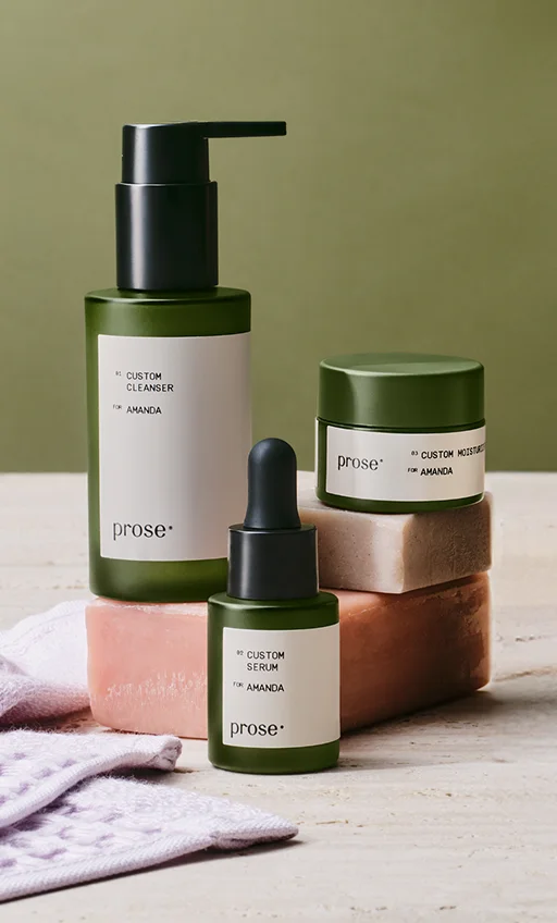 Custom Cleanser, Custom Serum, Custom Moisturizer displayed near bars of soapl