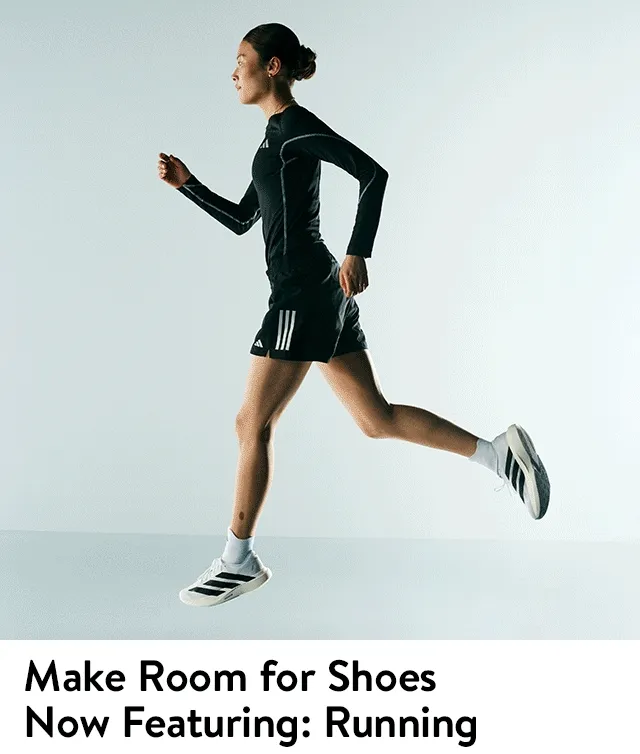 Woman wearing activewear and adidas running shoes.