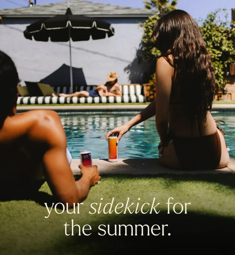 your sidekick for the summer. two friends lounging by the pool sipping hiyo.