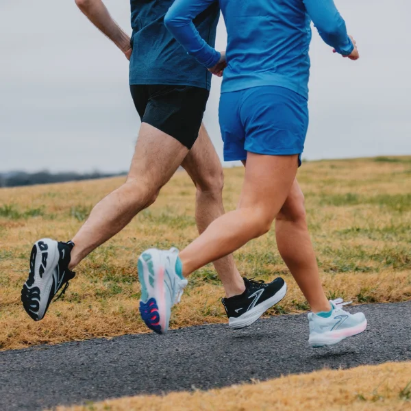 Man and woman wearing running shoes