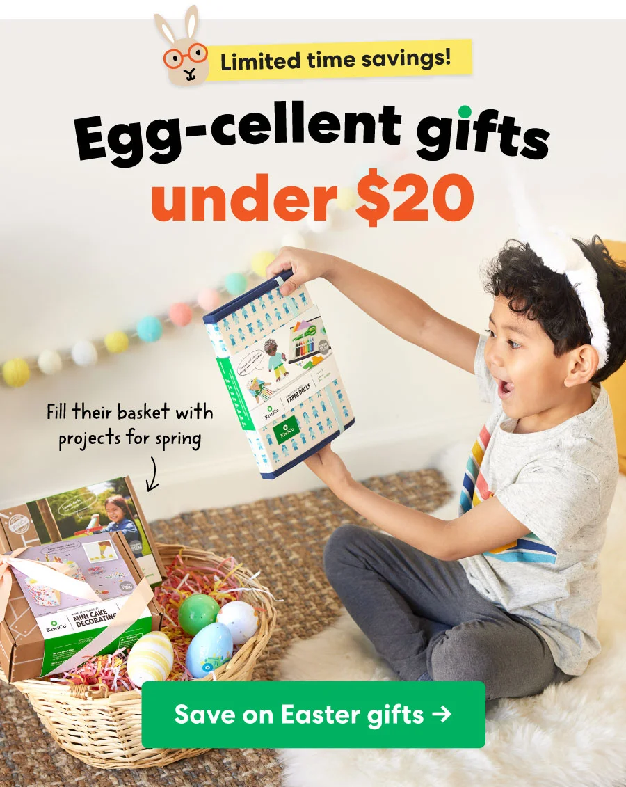 A young girl with curly hair, wearing a colorful striped dress, excitedly reaches for a KiwiCo project from a wicker Easter basket filled with activity kits, pastel eggs, and festive decorations. The text overlay reads, ''Egg-cellent gifts under $20'' with a playful bunny icon and a call-to-action button: ''Save on Easter gifts →.''