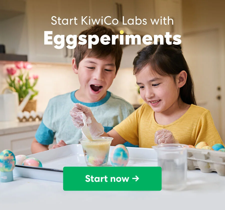 A young boy and girl, both smiling, engage in a fun chemistry experiment in the kitchen, using clear cups filled with liquid. The text overlay reads, ''Start KiwiCo Labs with Eggsperiments,'' with a ''Start now →'' button.