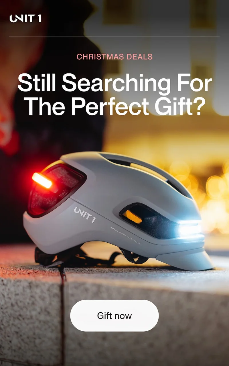 A UNIT 1 AURA smart helmet glowing at night, highlighting Christmas Deals for last minute gift shoppers.