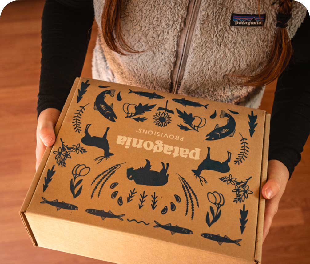 Someone holding the Patagonia® Provisions gift box.