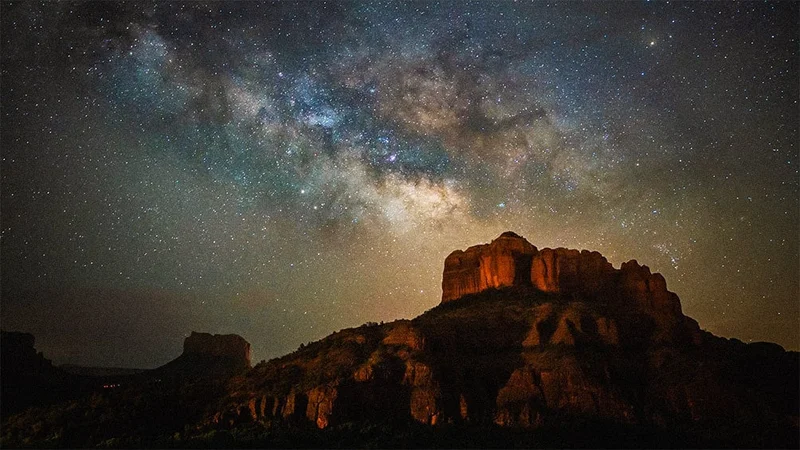Image description: Starry night over Cathedral Rock, in Sedona, Arizona