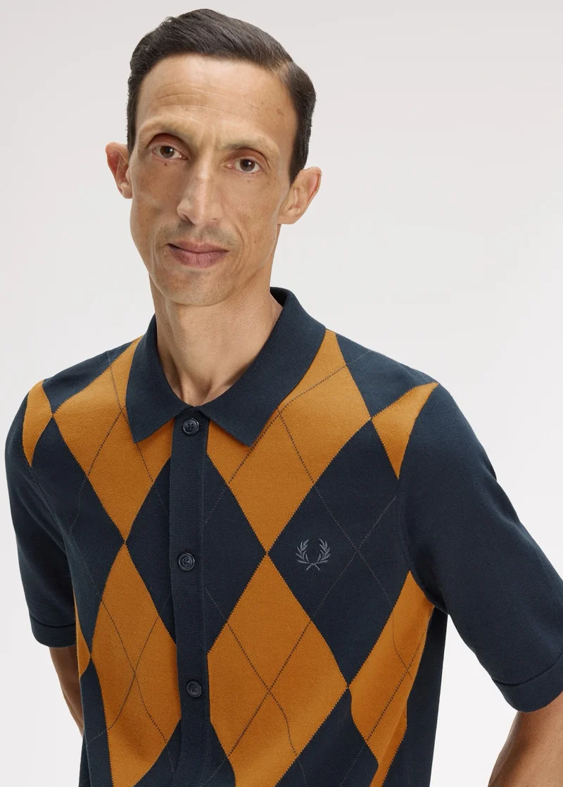 Male model wearing a Fred Perry Argyle Button Through Shirt in Navy