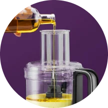 Liquid being poured into the 7-cup nutribullet Food Processor work bowl