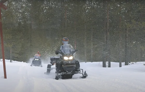 Riders on Lynx sleds