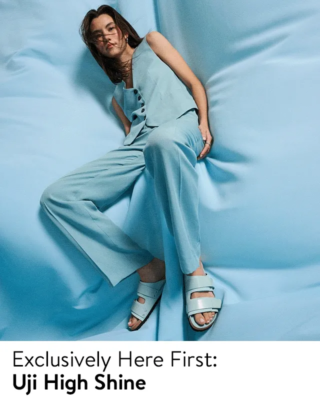 Woman wearing Birkenstock Uji High Shine sandals, plus sandals in nude and black.