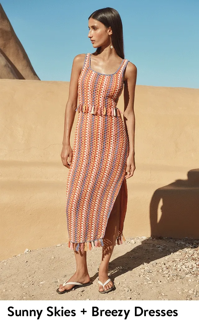 Woman wearing a crocheted midi dress.