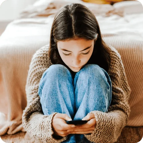 a teen girl on her smartphone a teen girl on her smartphone
