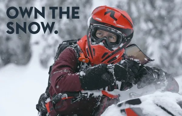 Riders driving their Lynx snowmobiles