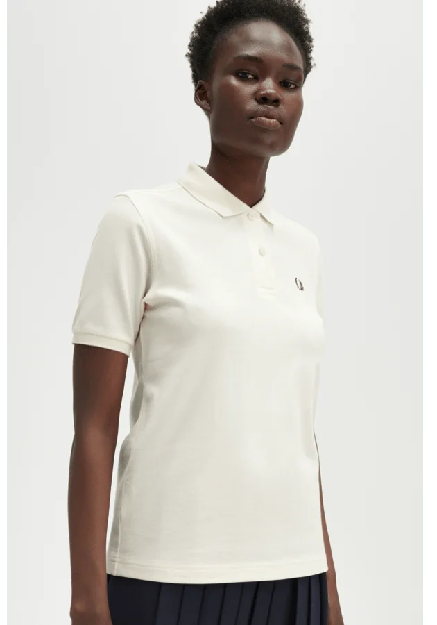 Womens Ecru polo shirt with a carrington brick coloured laurel wreath