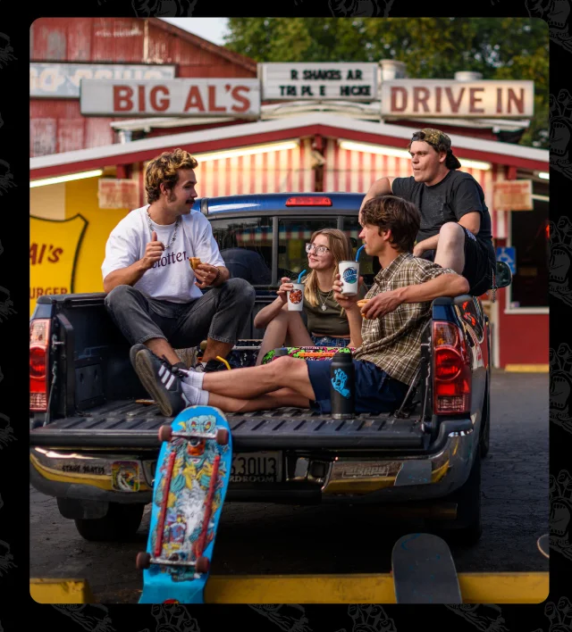 Skateboarders in back of pickup