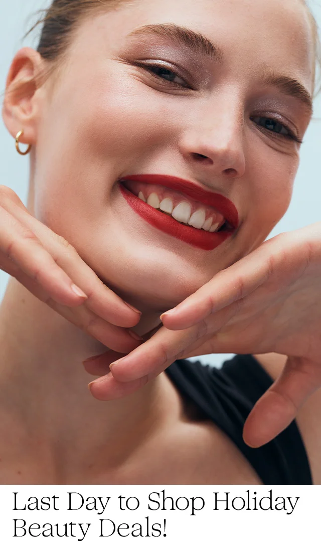 A smiling woman with red lipstick.