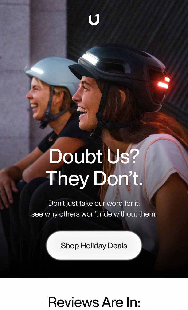 Two women smiling while wearing smart helmets with lights activated, promoting trust in product quality with the caption: 'Doubt Us? They Don’t. Don’t just take our word for it; see why others won’t ride without them.'