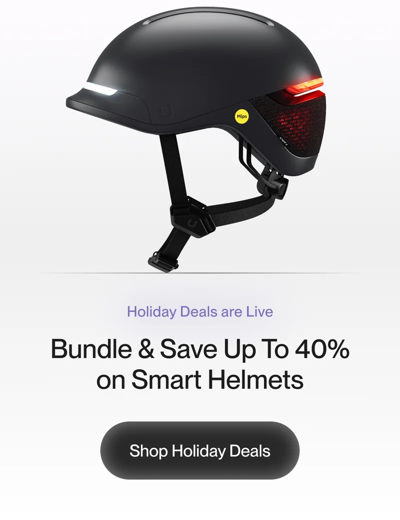 Smart helmet with integrated front and rear lights, featuring a MIPS logo. Holiday deals banner with offer to bundle and save up to 40% on smart helmets.