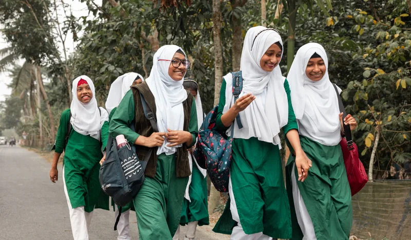 Jui walks to school with her fellow students.