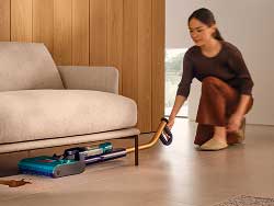 The Dyson Clean+Wash Hygiene used to clean under a low sofa.