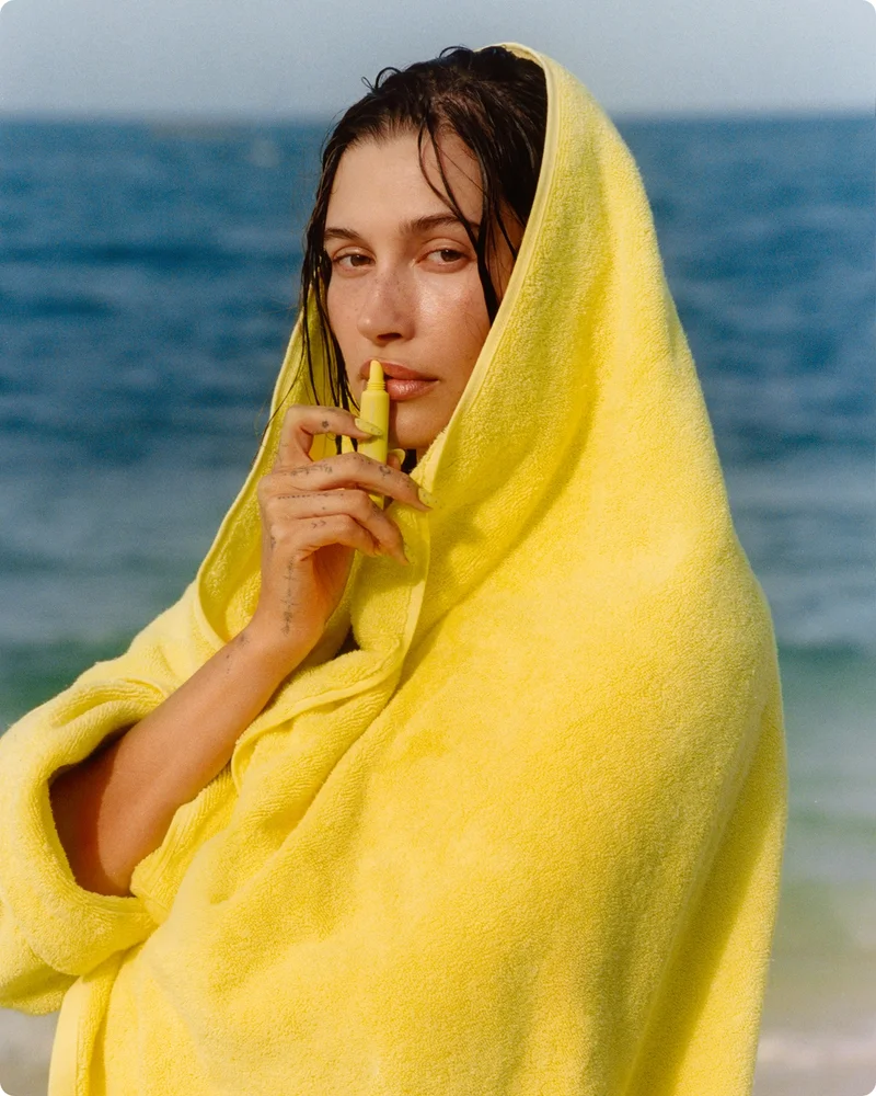 hailey with peptide lip tint in lemontini