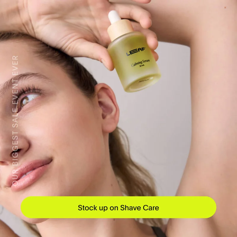 Stock up on Shave Care - a women looking into the distance holding a Leaf calming serum bottle