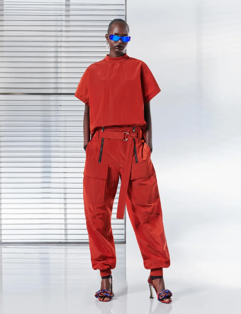 Ferrari total look with fluid T-shirt, parachute trousers and woven sandals