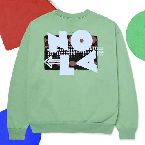 a green sweatshirt with NOLA on it