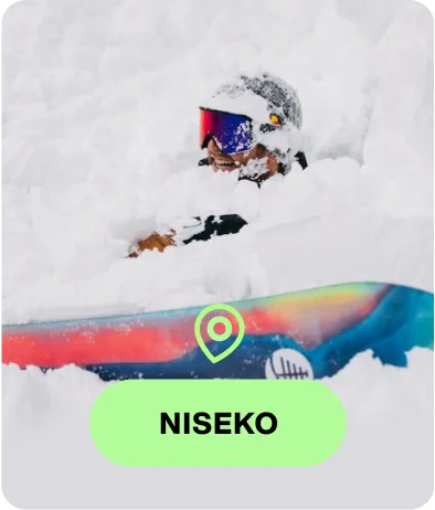 Snowboarder riding a Burton board in Burton Outerwear with the text Niseko