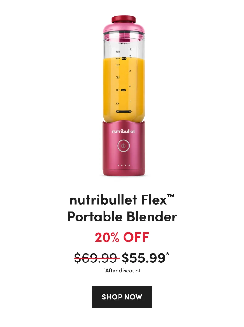 A ruby red nutribullet Flex Portable Blender filled with yellow smoothie, featuring a power button and measurement markings.