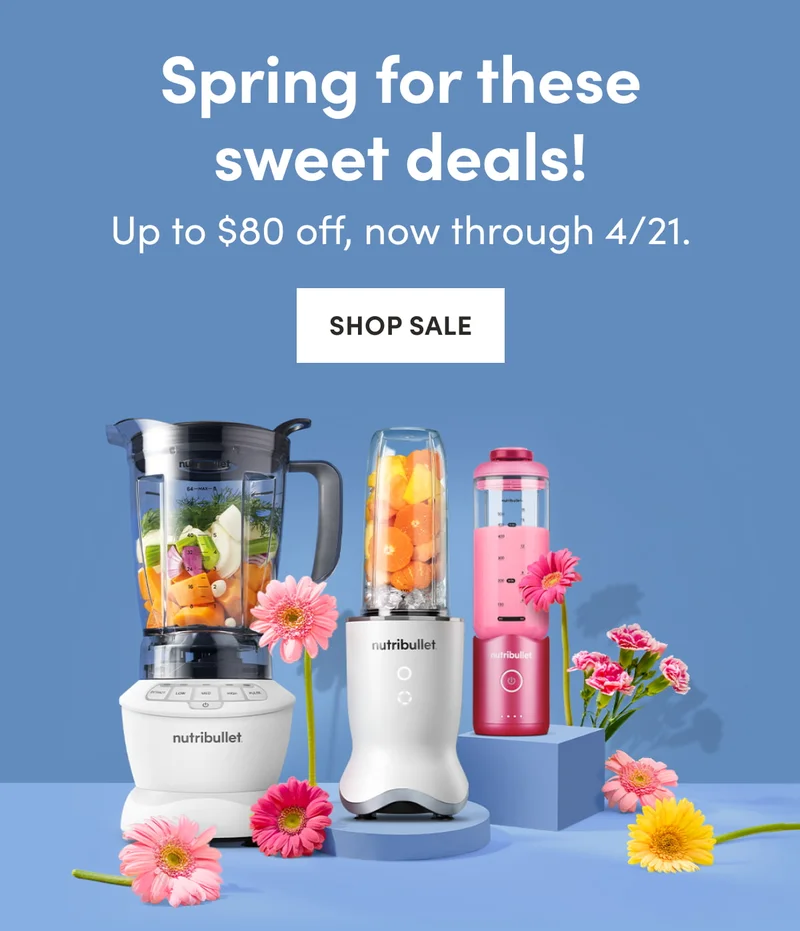 A nutribullet blender lineup, including full-sized and portable models, styled with vibrant pink gerbera daisies against a blue backdrop.