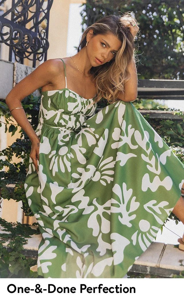 A woman wearing a printed maxi dress.