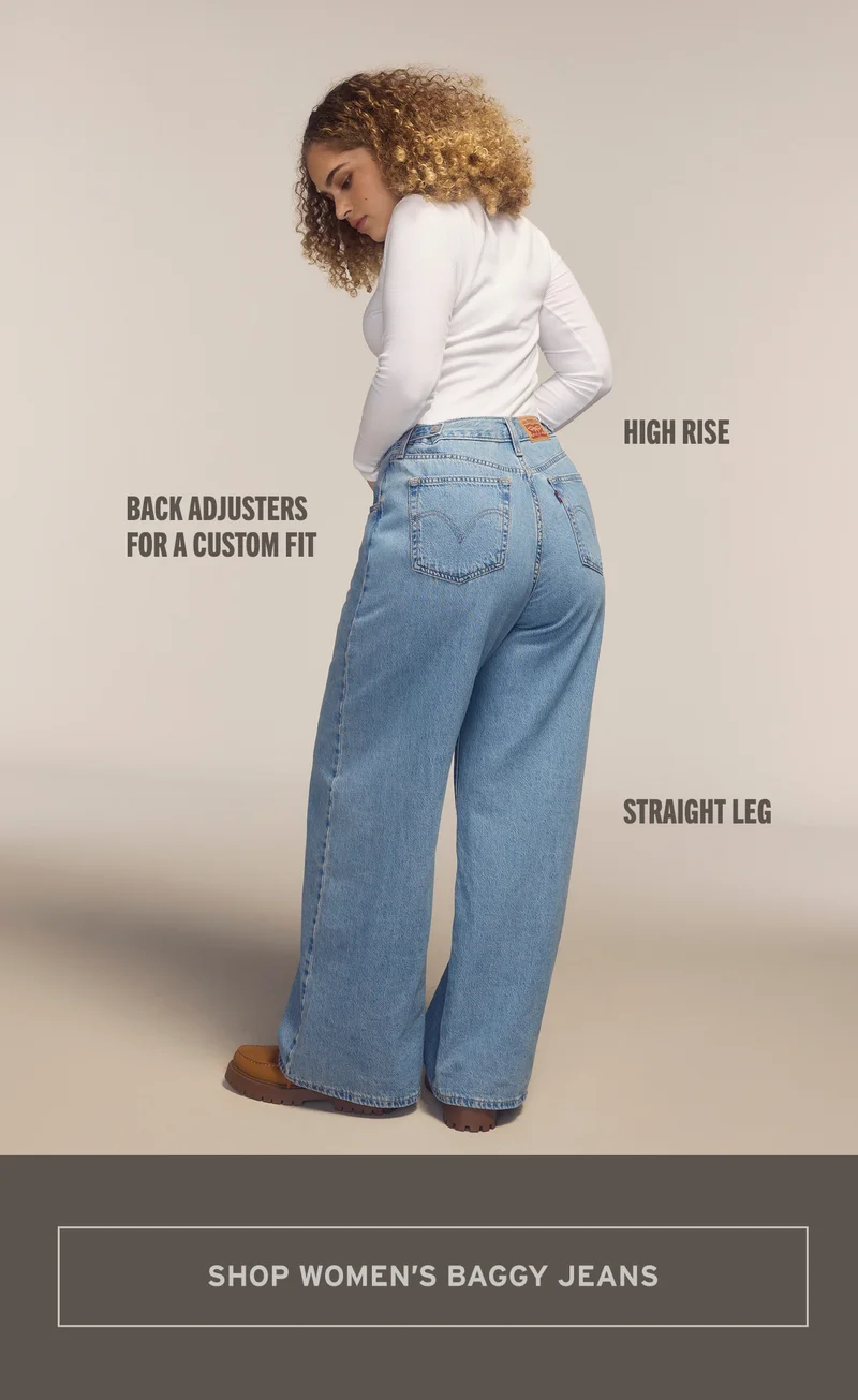 Person in a white long sleeve and medium wash jeans.