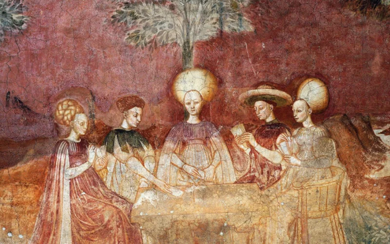 A fresco (painted in 1450) at the Palazzo Borromeo in Milan depicts five people playing the tarot card game.